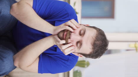 Vertical-video-of-Depressed-unhappy-man.